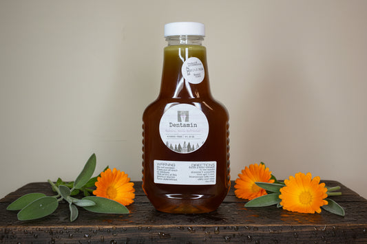 Bottle of liquid with a label on a textured surface