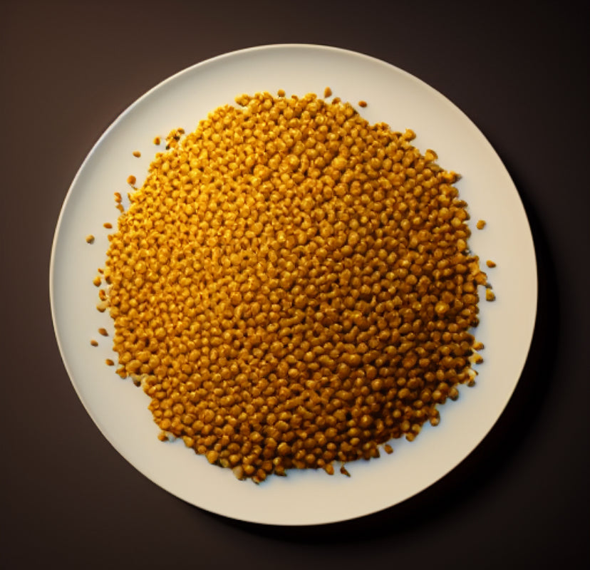 White plate with a pile of soybeans on a dark background